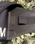 Black bag with 'BRM' branding on a green leafy background